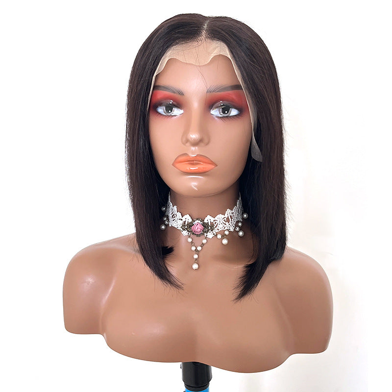 Mannequin head with a black wig on a white background