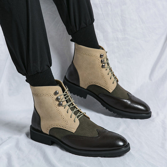 Pair of green and beige boots with black soles on a white background