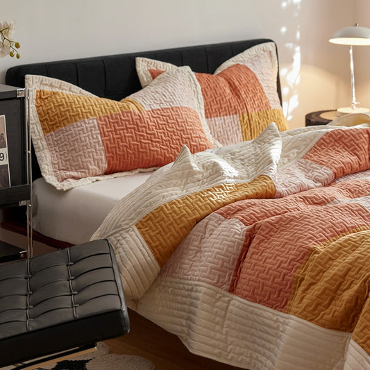Bed with patchwork quilt and pillows in a bedroom setting