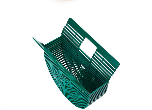 Green plastic basket on a white background