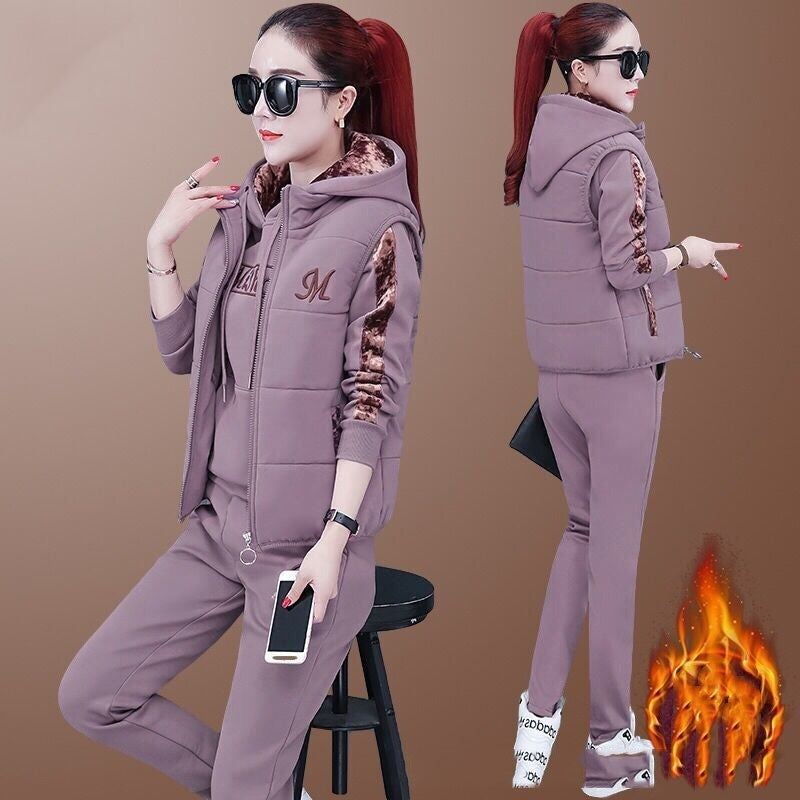 Woman in a purple tracksuit with flame graphic on a brown background