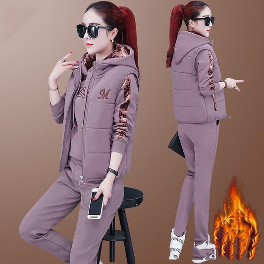 Woman in a purple tracksuit with flame graphic on a brown background