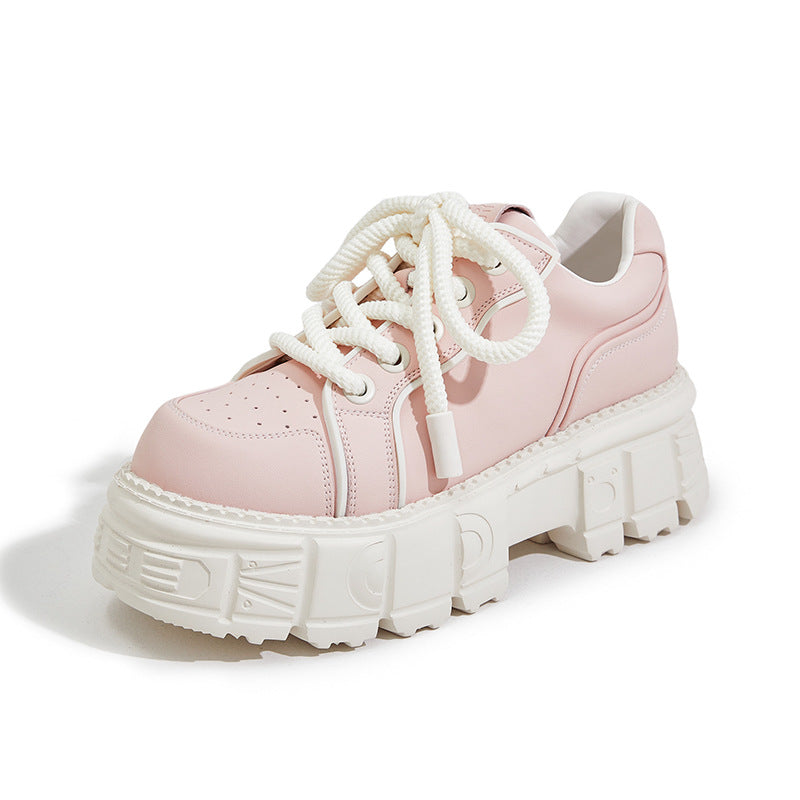 Pink sneaker with white laces and sole on a white background
