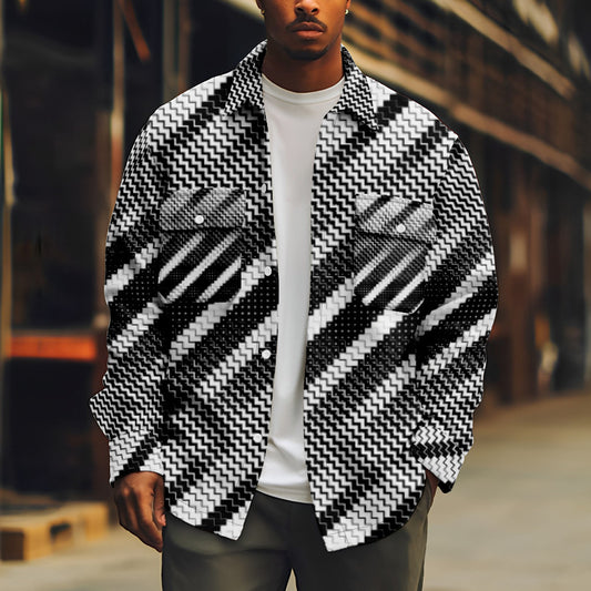 Person wearing a black and white patterned jacket on a blurred street background