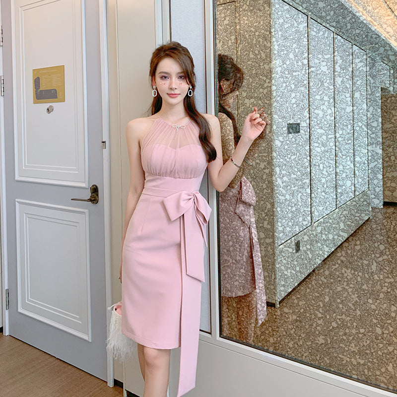 Woman in a pink dress standing in front of a mirror by millivan