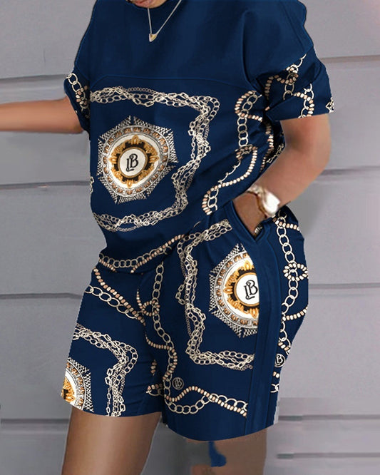 Navy outfit with gold chain pattern on a plain background