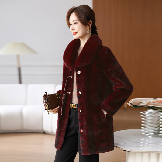 Woman wearing a burgundy coat in an indoor setting by millivan supplies