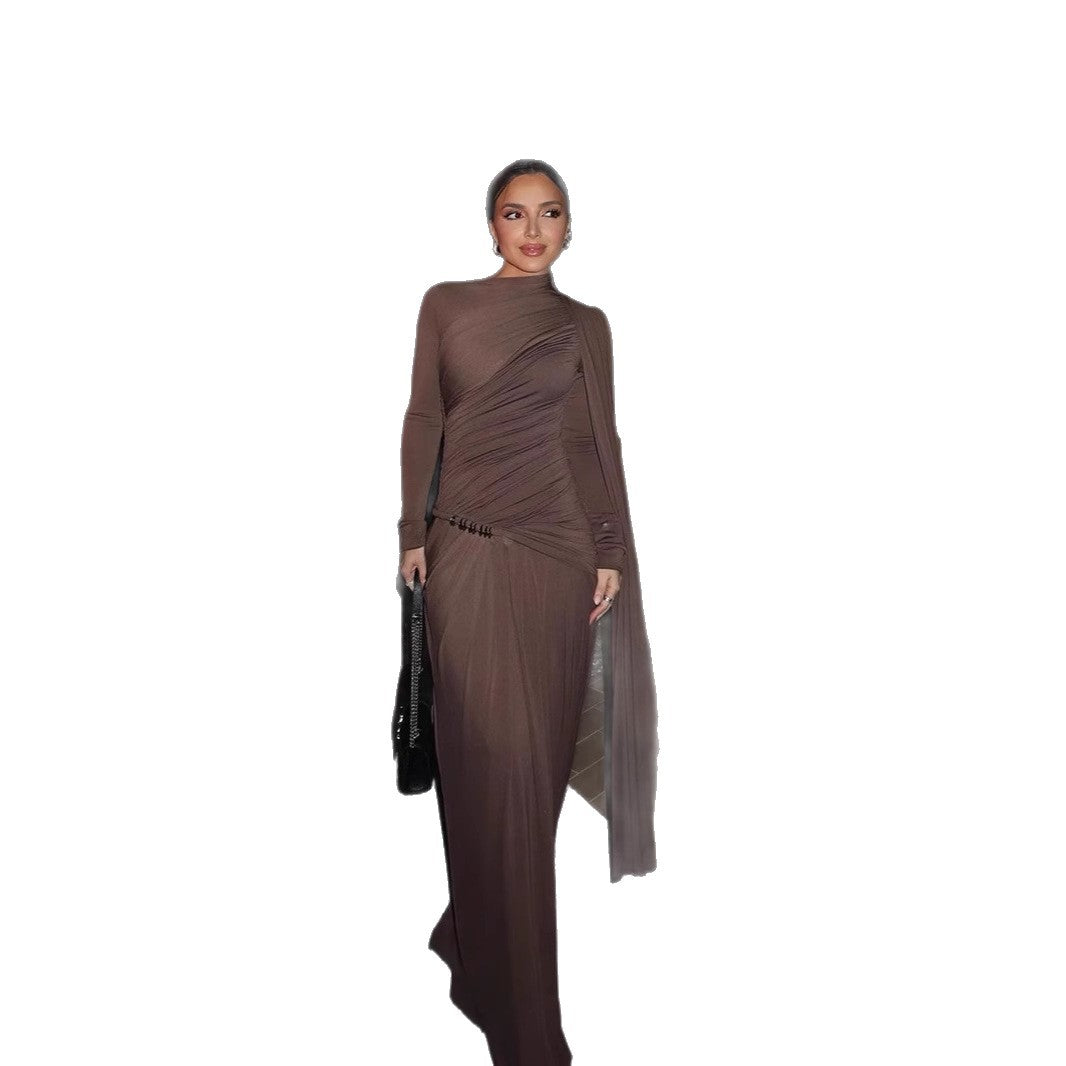 Woman wearing a brown dress with a long train on a white background