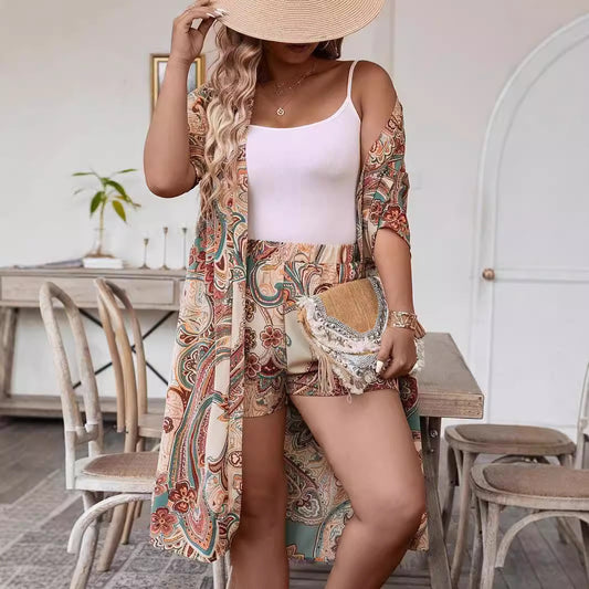 Woman wearing a floral dress and straw hat in a casual indoor setting