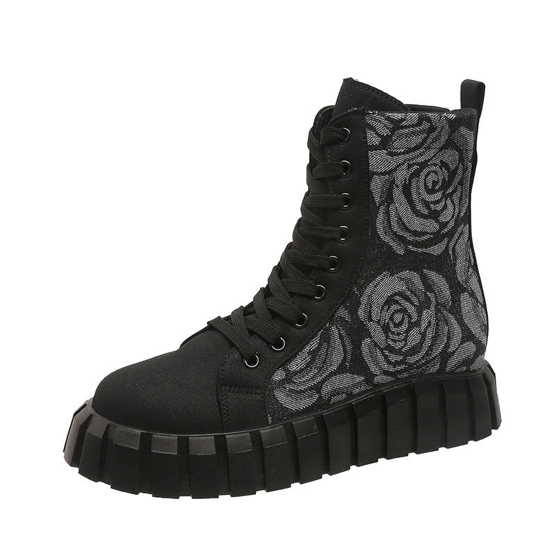 Black high-top boot with rose pattern on a white background