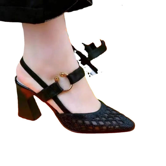 Black high-heeled shoe with a strap on a white background