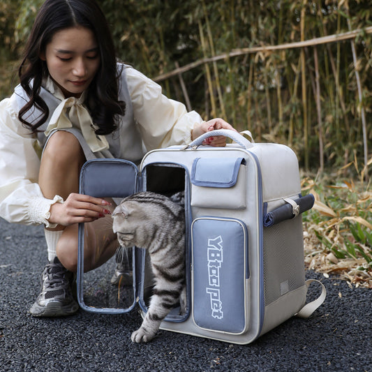 Woman with a cat inside a pet carrier on a path with plants in the background