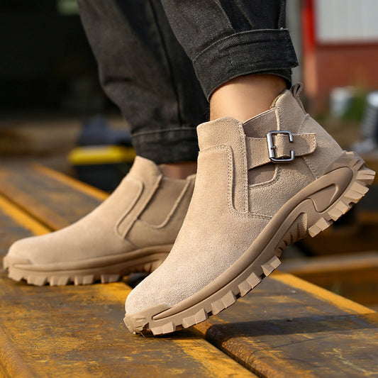 Beige boots with a buckle on a wooden surface
