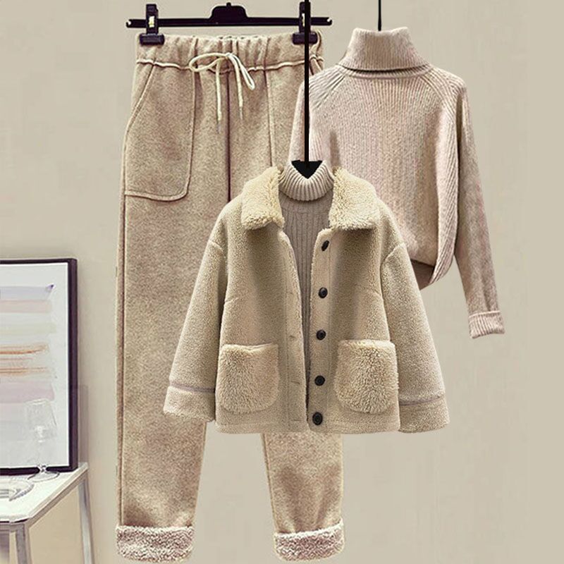 Beige winter outfit with coat, pants, and sweater on a mannequin against a neutral background.