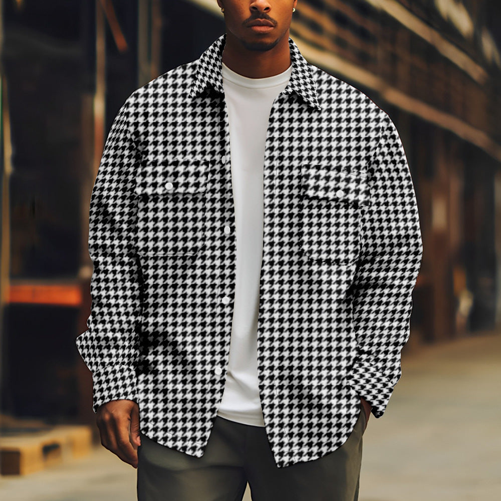 Person wearing a black and white houndstooth patterned shirt with a blurred background