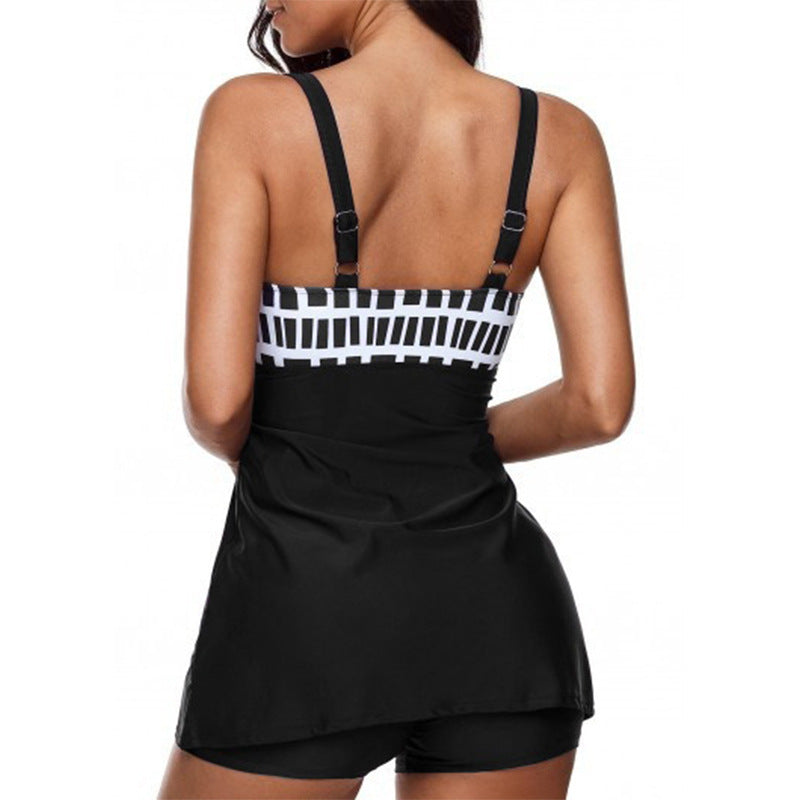 Black and white checkered top with a black skirt on a white background