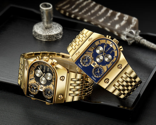 Two gold watches with intricate designs on a dark surface