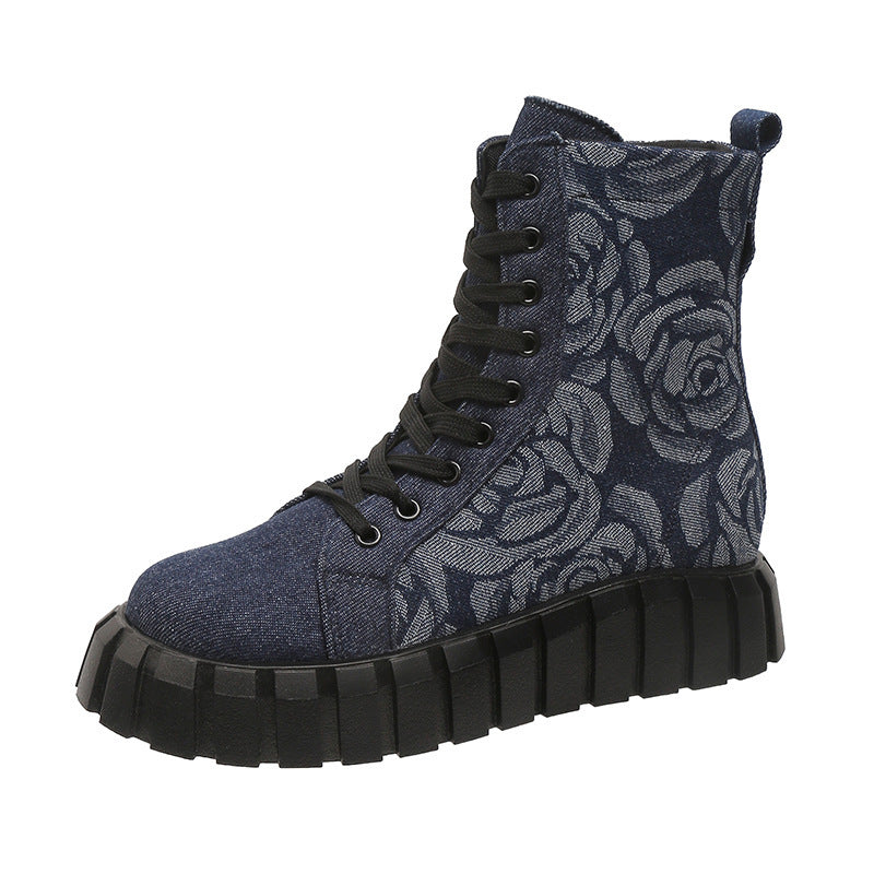 Blue floral-patterned boot with black sole on a white background