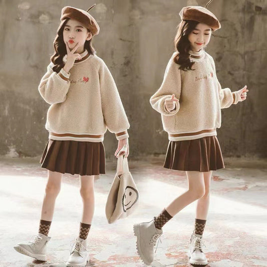 Two identical images of a girl in a beige sweater and brown skirt posing against a textured wall.