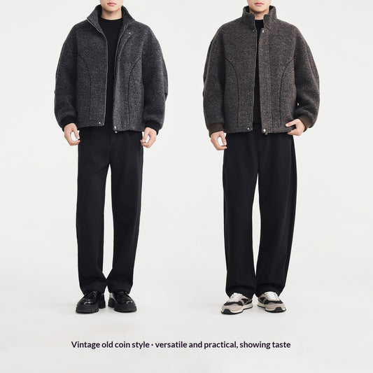Two views of a person wearing a gray vintage-style jacket and black pants on a white background.