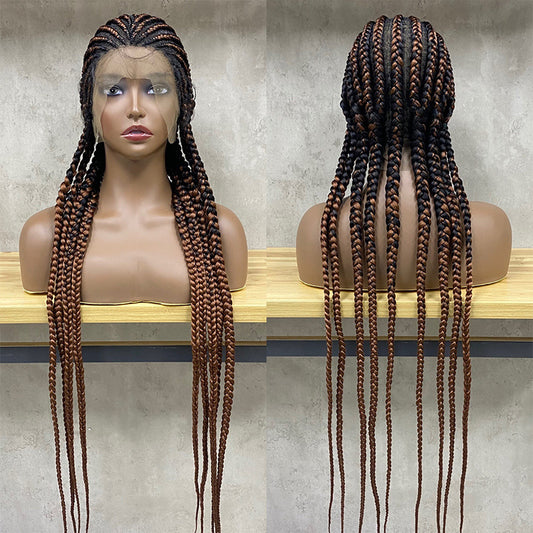 Mannequin head with long braided hair on a wooden surface against a neutral background