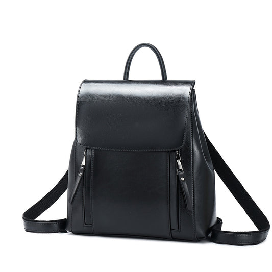 Black leather backpack on a white background