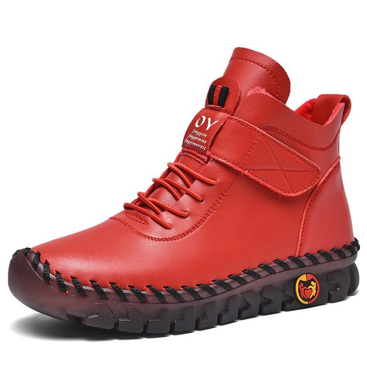 Red boot with black sole on a white background