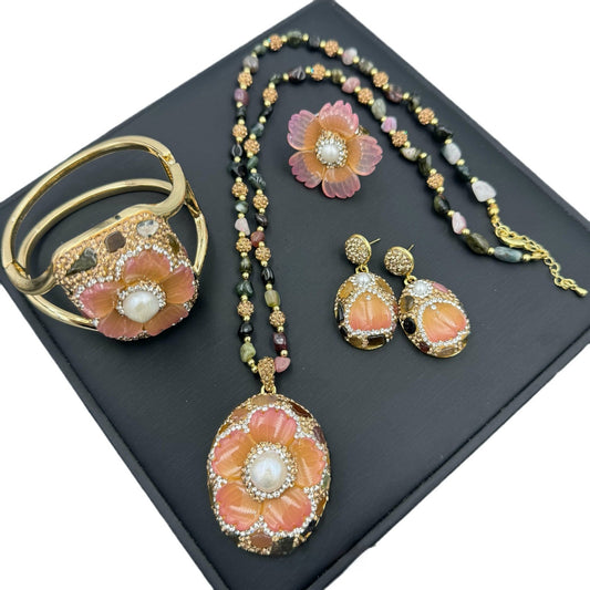Jewelry set with floral designs on a black background