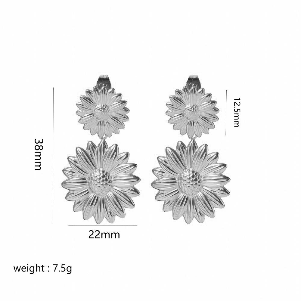 Silver flower-shaped earrings with measurements on a white background