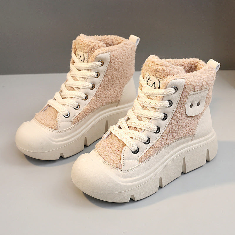 Pair of beige and white high-top sneakers with fuzzy texture on a light gray background