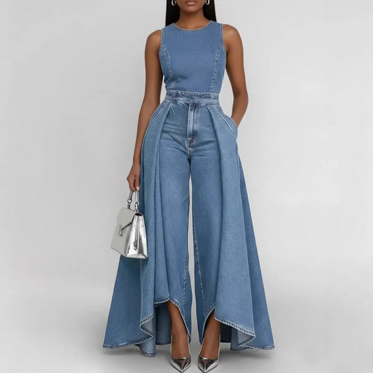 Woman wearing a blue denim jumpsuit on a gray background