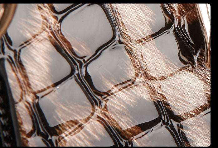 Close-up of a textured surface with brown and black patterns