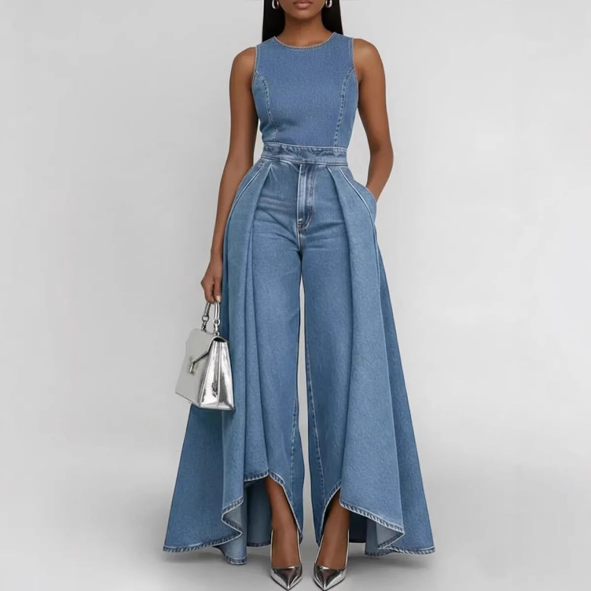 Woman wearing a blue denim jumpsuit on a white background