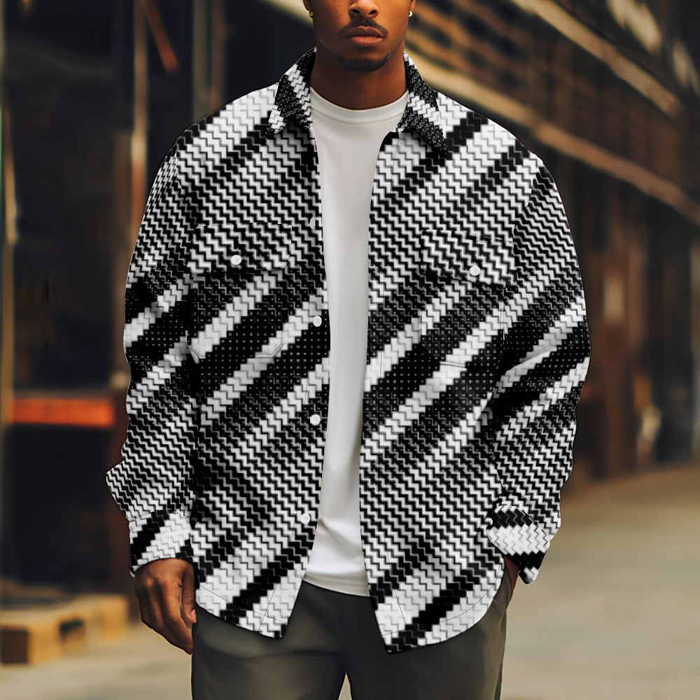 Person wearing a black and white patterned jacket with a blurred background