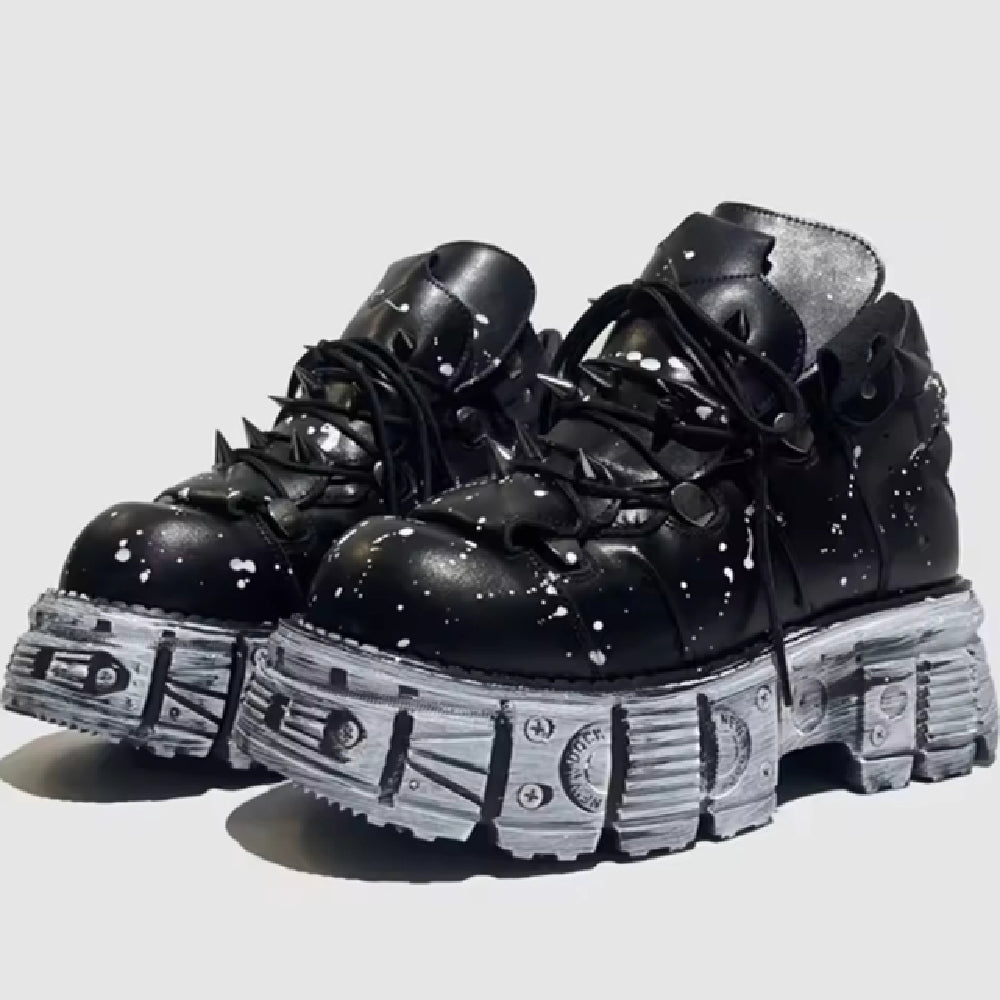 Black platform boots with unique sole design on a light gray background