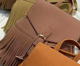 Women's Frosted Tassel Backpack - Solid Color