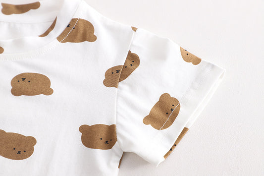White fabric with brown bear patterns on a light background