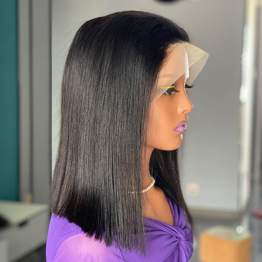 Mannequin head with a black straight wig and purple top.