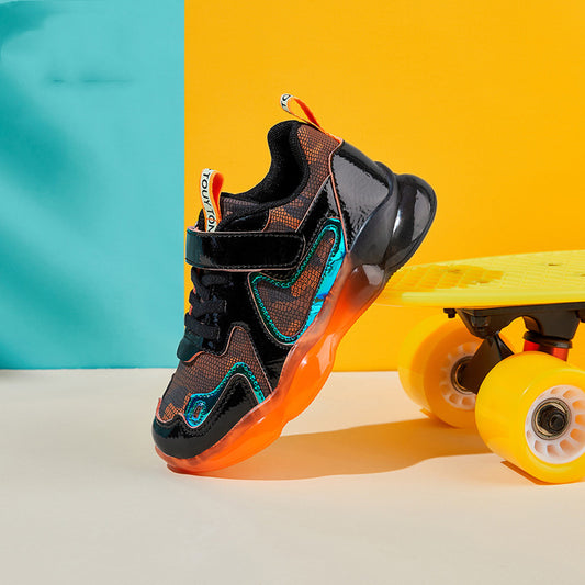 Black and orange sneaker with colorful accents on a yellow and blue background