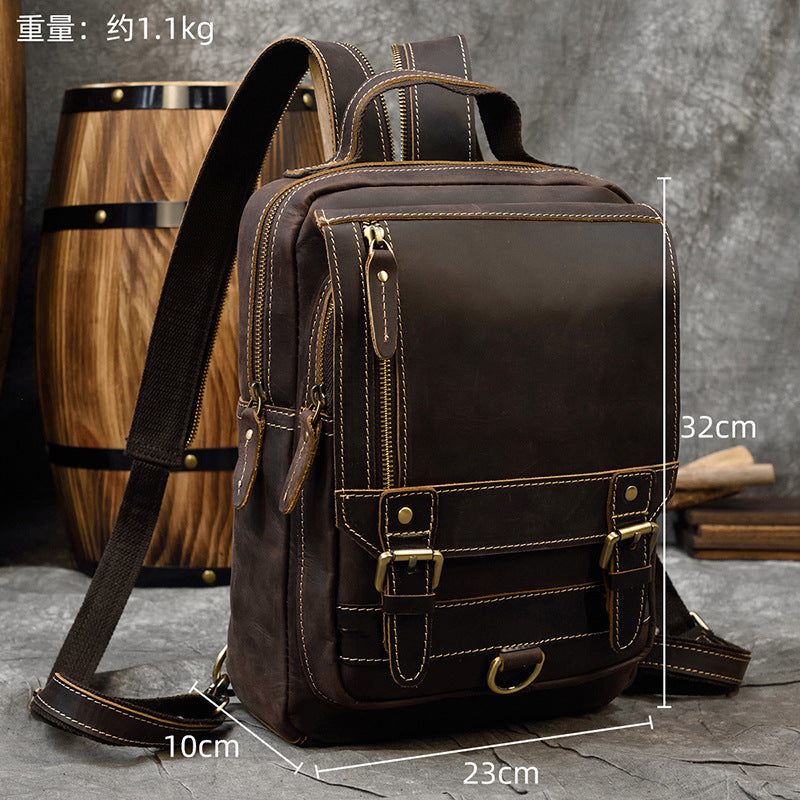 Brown leather backpack with measurements on a gray surface with wooden barrel in the background