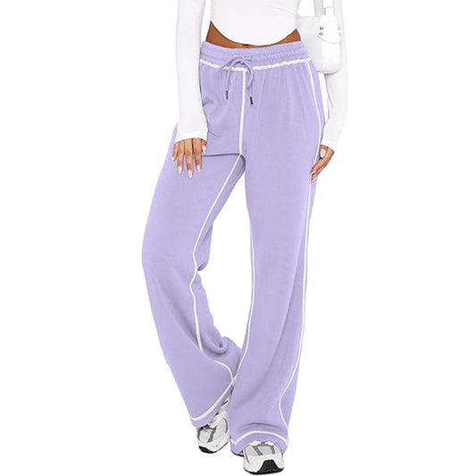 Lavender sweatpants with white trim worn by a person on a white background