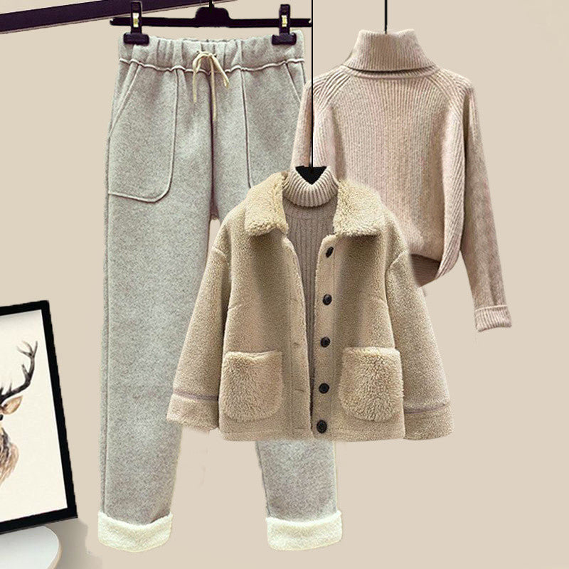 Coat, pants, and sweater set on a beige background