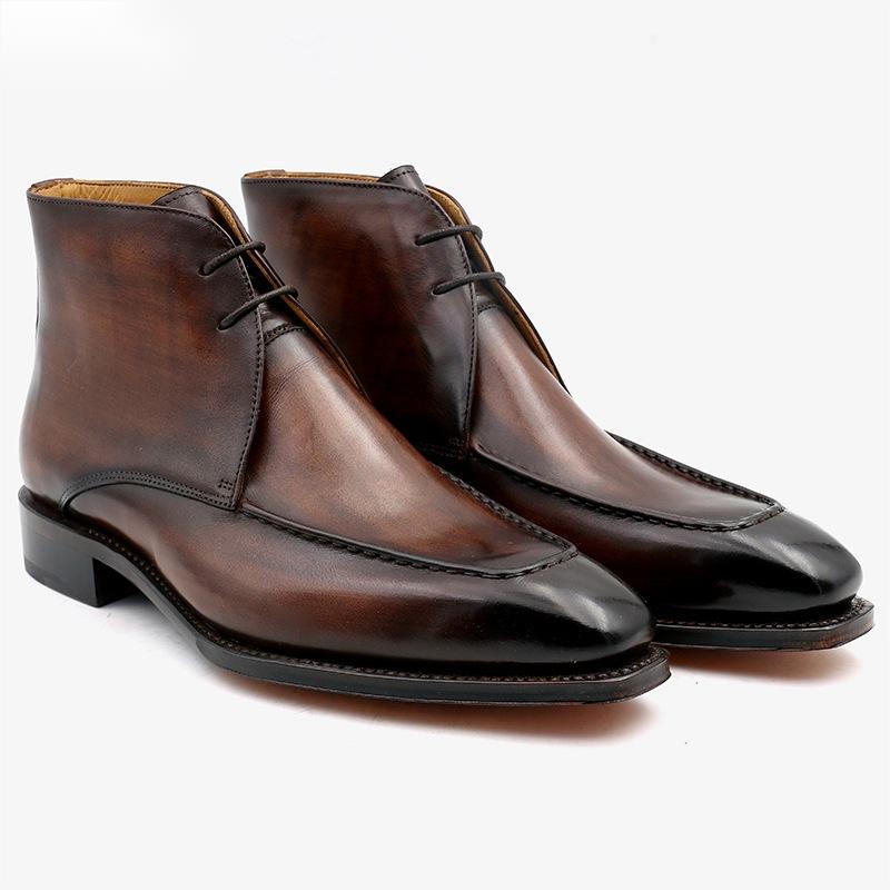 Pair of brown leather dress shoes on a white background