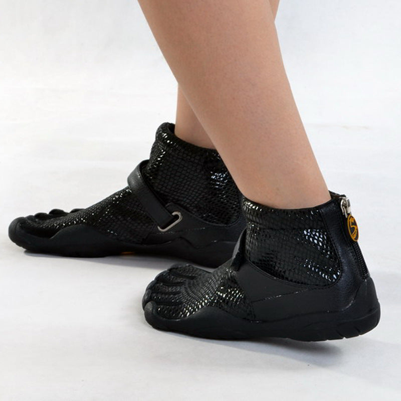Black shoes with unique sole design on a white background