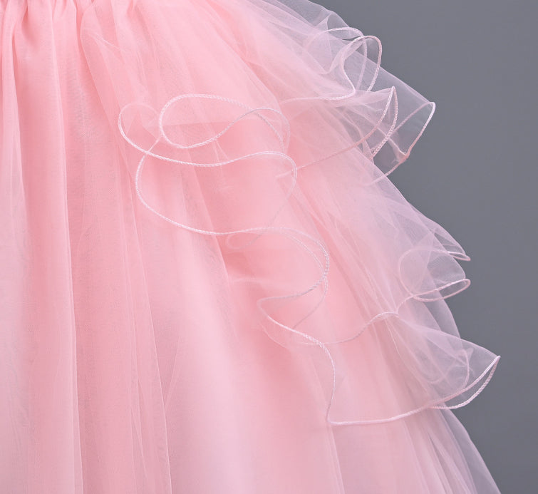Close-up of a pink ruffled fabric against a gray background