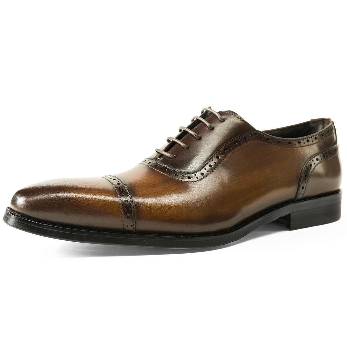 Brown leather dress shoe on a white background