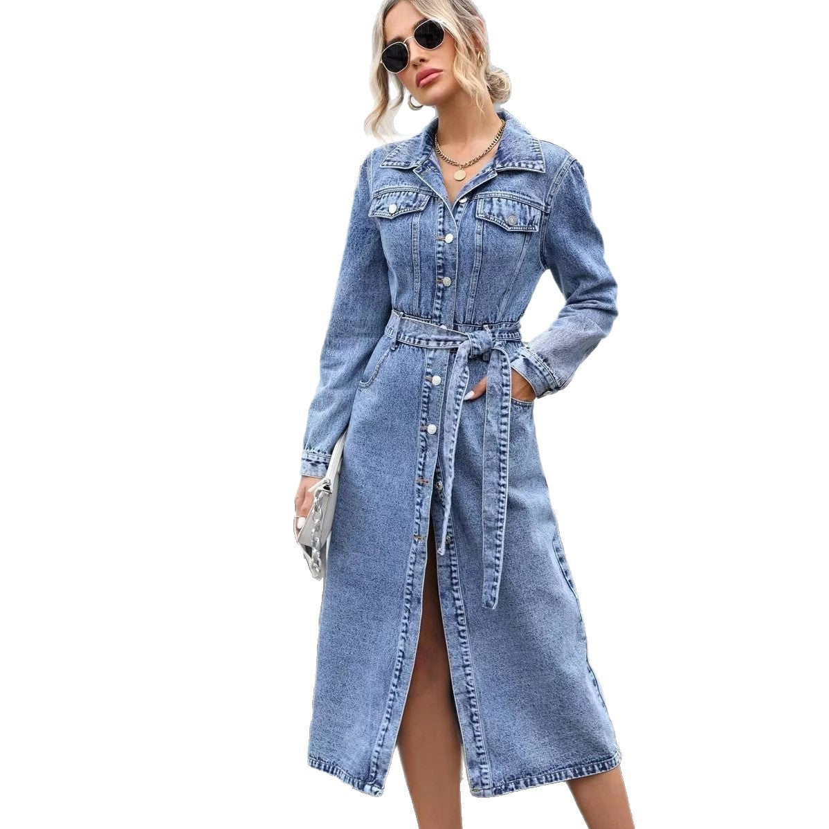 Woman wearing a blue denim dress on a white background