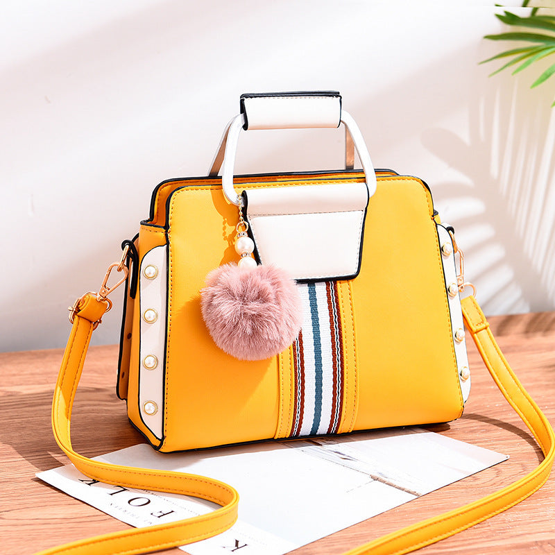 Luxury fashion handbag for women in [color] - stylish, durable designer bag with multiple compartments, adjustable shoulder strap, and water-resistant lining - premium quality polyester handbag - Millivan Supplies