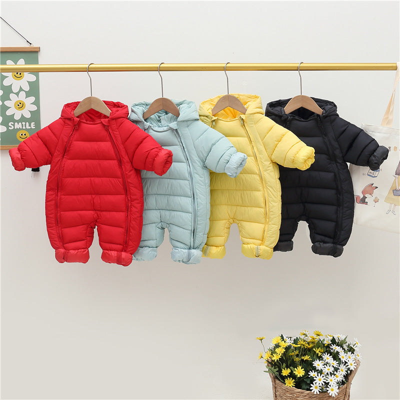Four colorful baby snowsuits hanging on a rack with a small basket of flowers at the bottom.