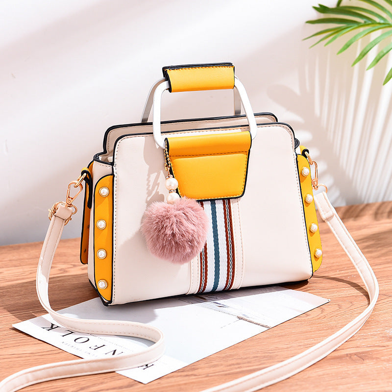 Luxury fashion handbag for women in [color] - stylish durable designer bag with multiple compartments, adjustable shoulder strap, and water-resistant lining - premium quality polyester handbag - Millivan Supplies